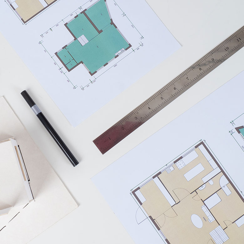 desk top table top architectural draft sitemaps floorplans for commercial real estate company sendero cross capital in dallas texas ruler