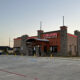 Burleson Texas Longhorn restaurant standing at dawn with empty parking lot ready to open sendero cross capital partners acquisition construction real estate property