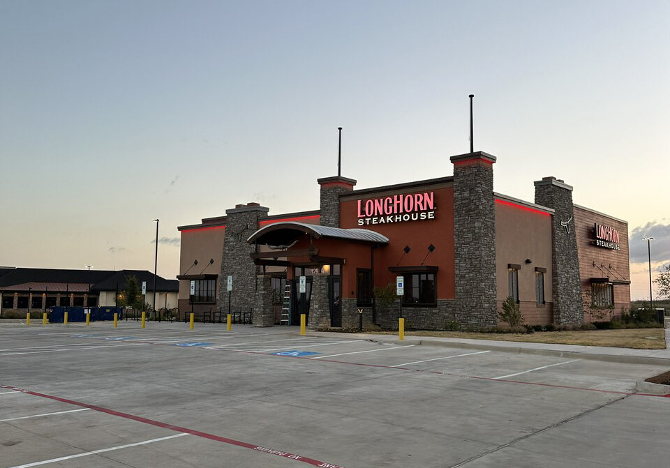 Burleson Texas Longhorn restaurant standing at dawn with empty parking lot ready to open sendero cross capital partners acquisition construction real estate property